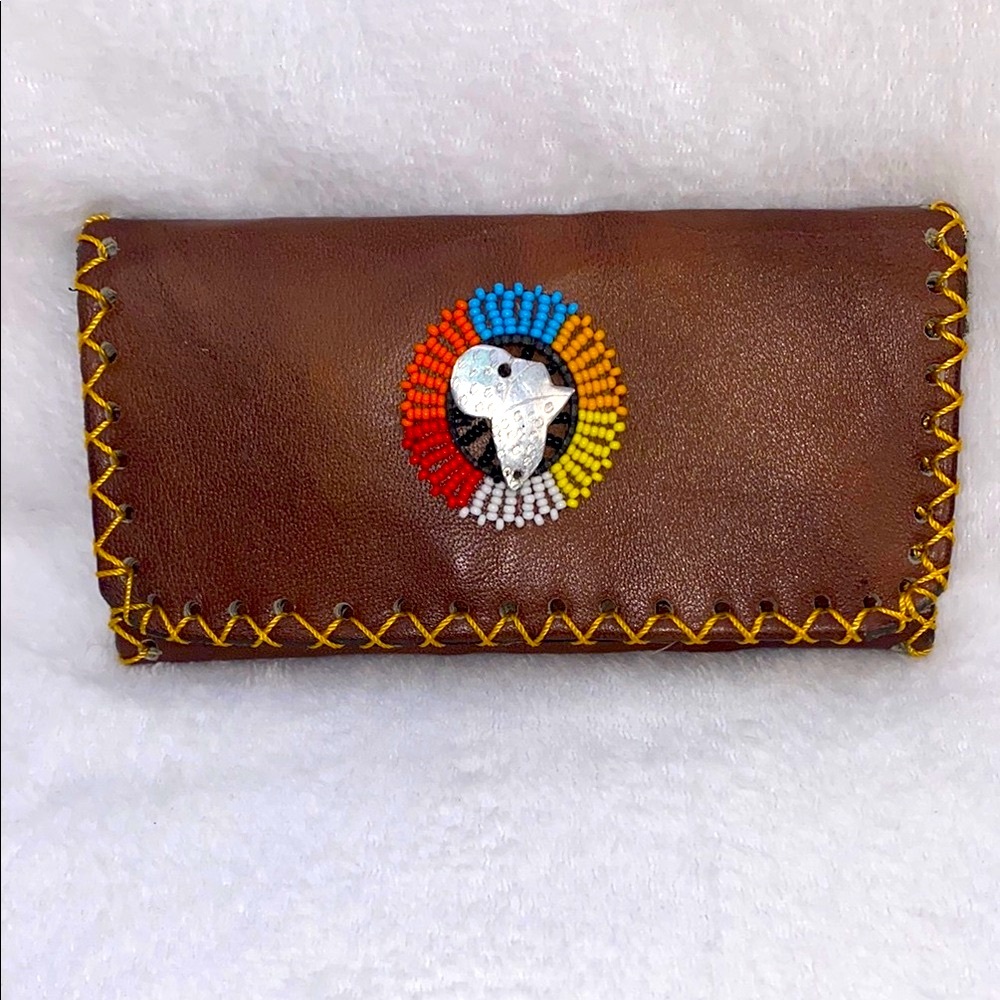 Brown and Yellow Wallet with Decorative Medallion